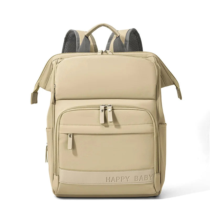 Vue de face d'un sac à langer original beige avec multipoche