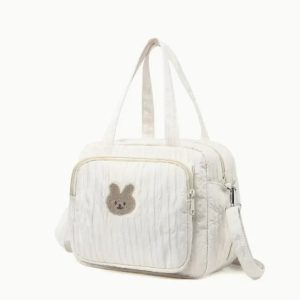 Sac à langer blanc avec multiples poches de rangement