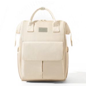 Sac à dos à langer beige avec multiples poches pour organisation