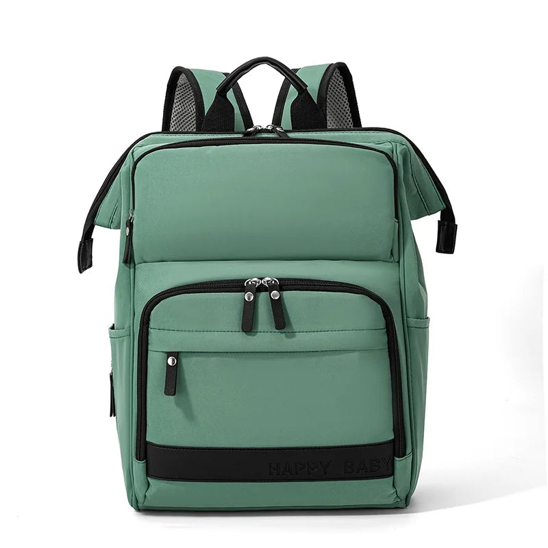 Sac à langer vert spacieux avec multiples poches