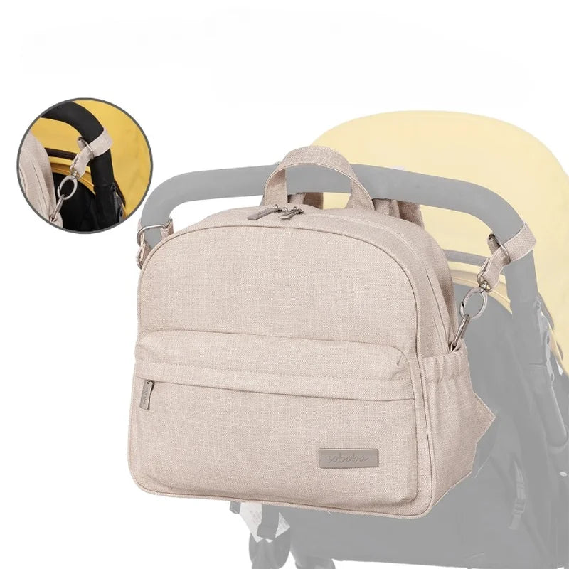 Sac à langer de voyage à dos élégant avec accessoires intégrés