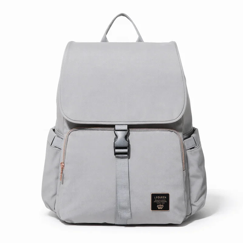 Sac à langer gris élégant avec poches multiples